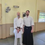 Sensei and Student following successful first dan grading
