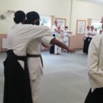 The "arms out from side and bending" exercise being used to throw partners