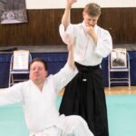 At Lochaber Aikido Club, student falls as teacher moves into the final position of 2nd form kokyunage.