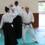 Two students testing for stability in the sideways exercise.