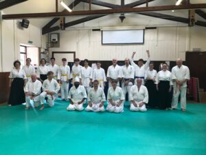 A group portrait of delighted (relieved?) students having passed their gradings.