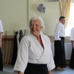 A smiling student prepared for her partner to attack